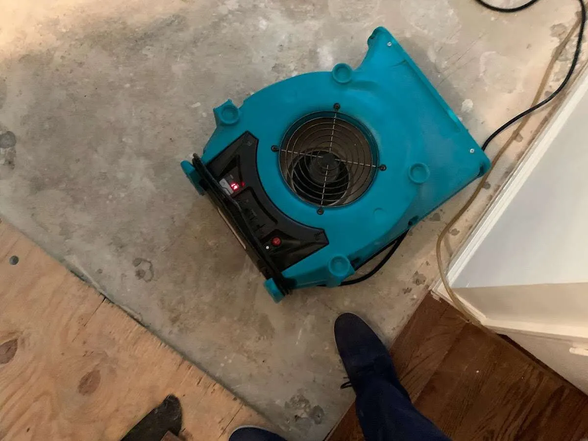 Air mover drying subfloor during Leak Detection & Repair in Kinnelon